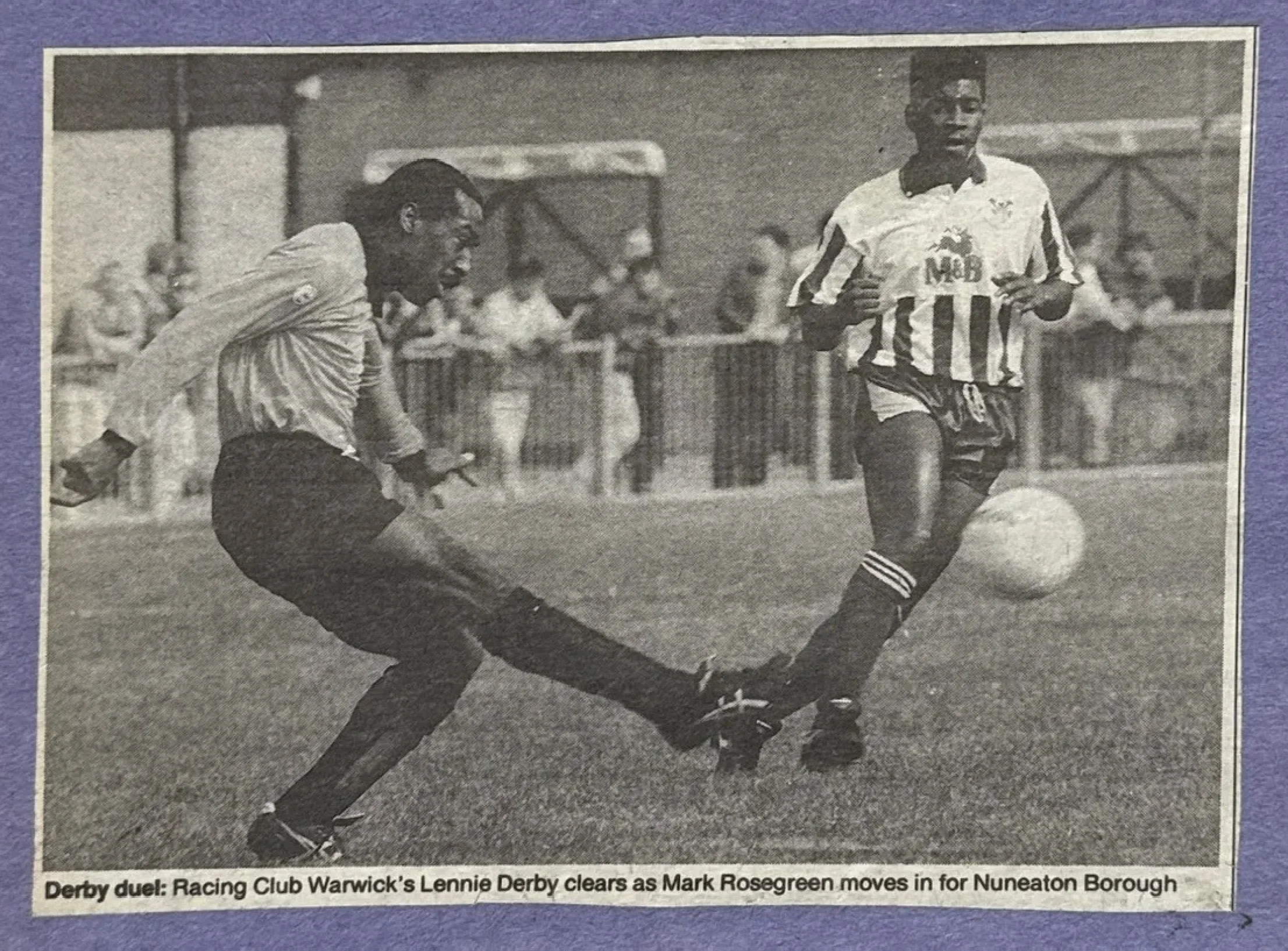 Derby duel: Racing Club Warwick's Lennie Derby clears as Mark Rosegreen moves in for Nuneaton Borough