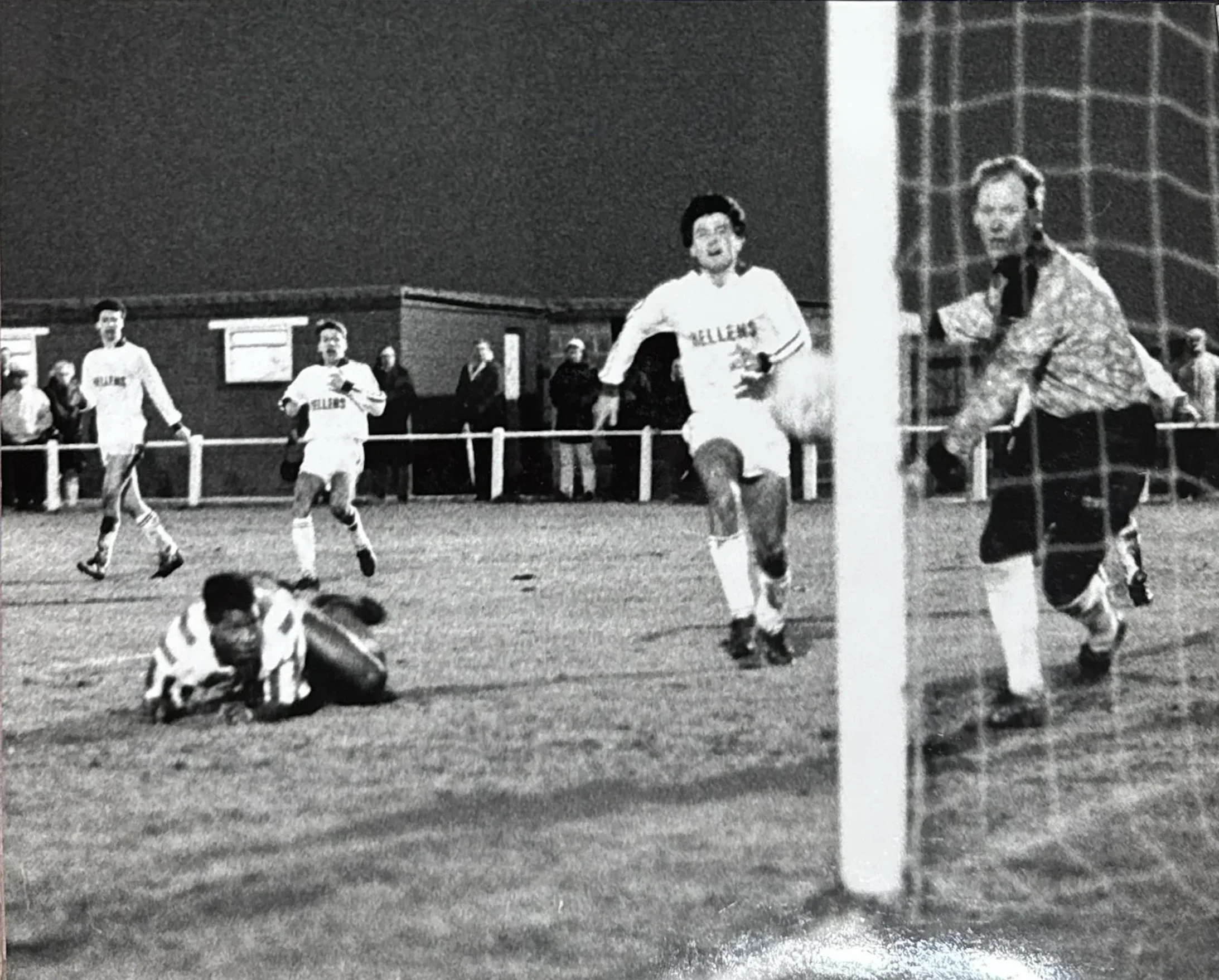 Mark Rosegreen slides in to score in a night match